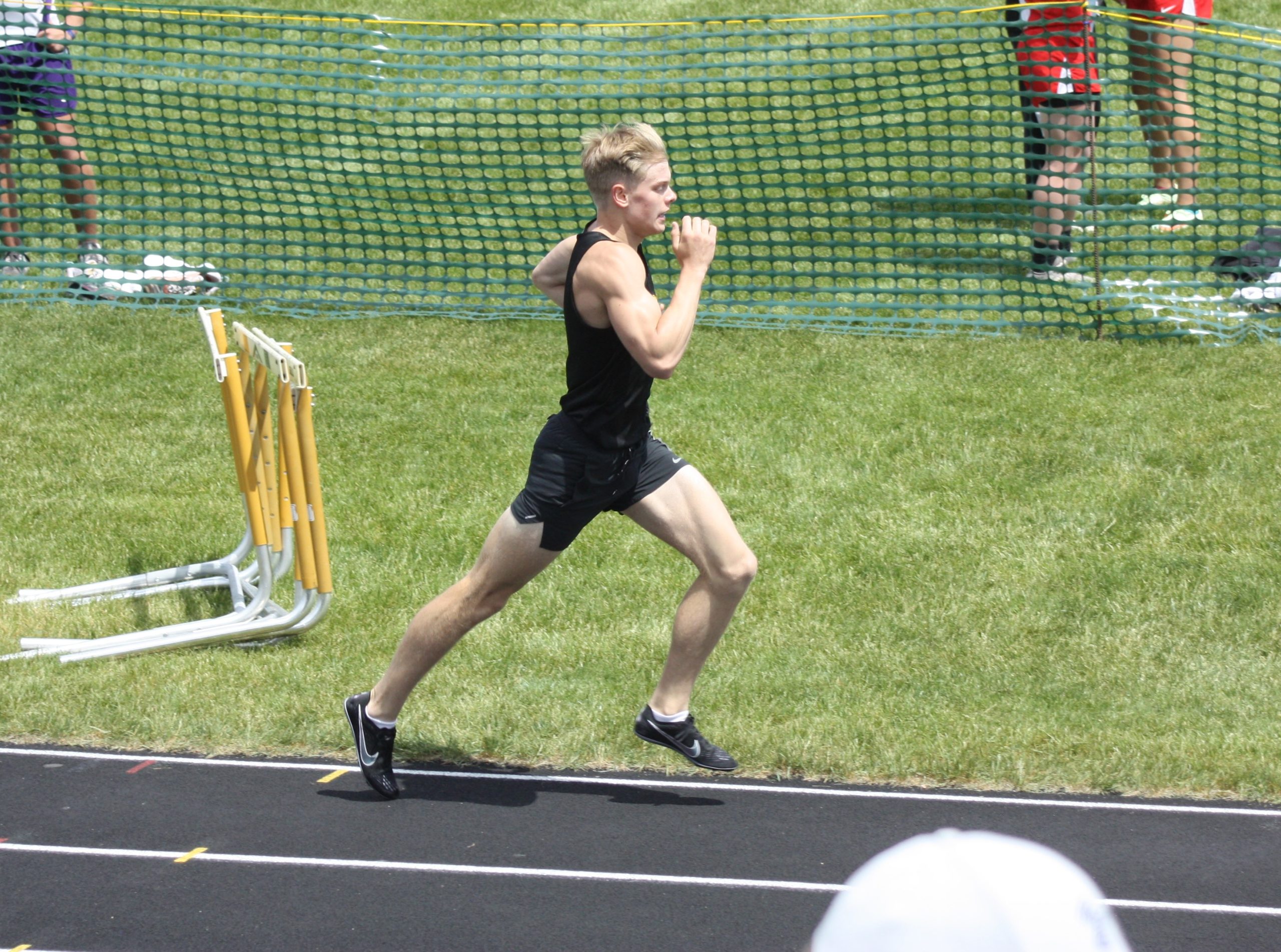 Student running on a track