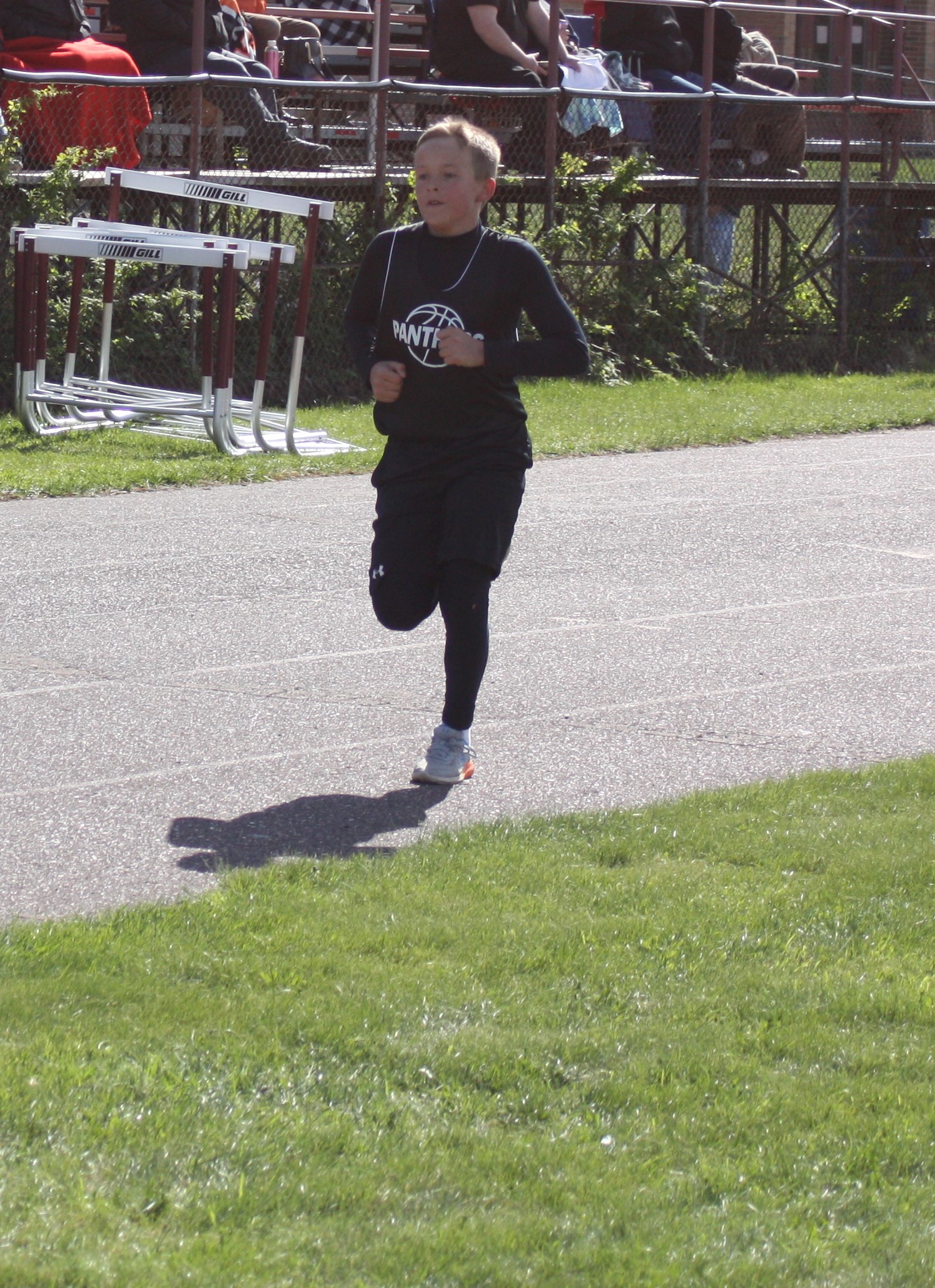 Student running on a track