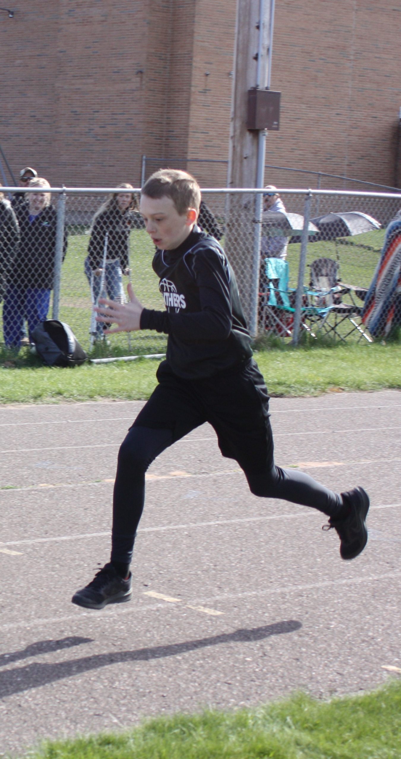 Student running on a track